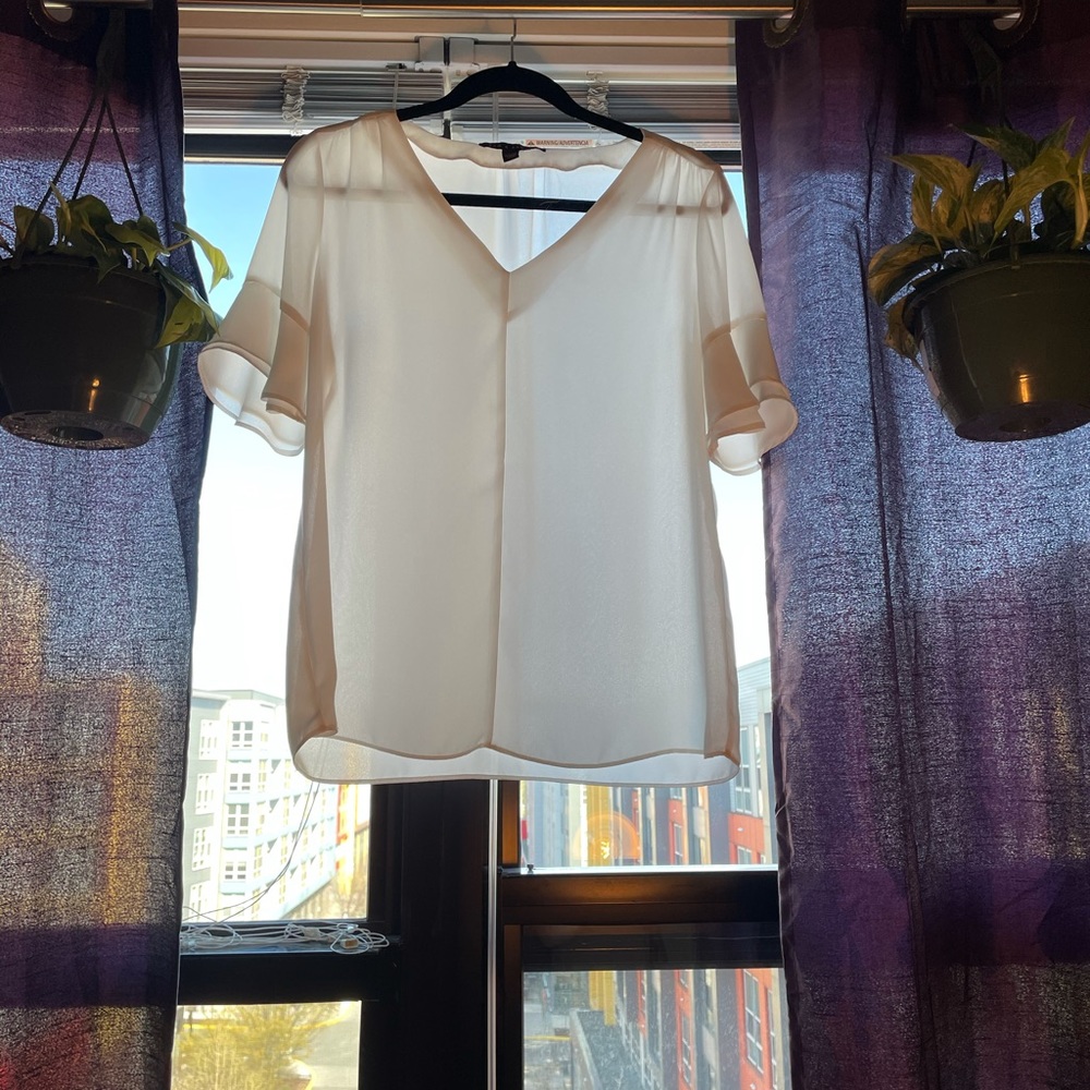 Modern white blouse with sleeve flare detail